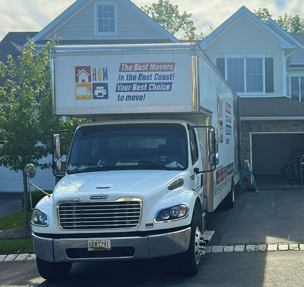 Professional commercial movers loading office equipment